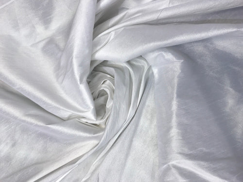 White Shantung/Dupioni fabric. 54" wide. Shantung fabric is unique blend makes this fabric soft and gives structure to dress.