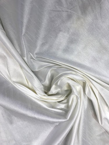 Ivory Shantung/Dupioni fabric. 54" wide. Shantung fabric is unique blend makes this fabric soft and gives structure to dress.