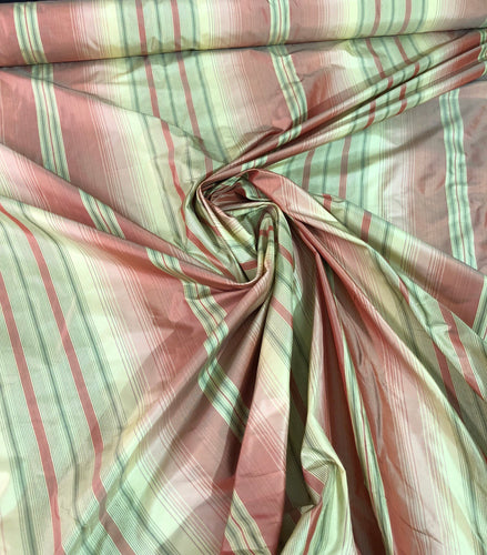 100% silk taffeta stripe 54" wide                      Sold by the yard          Light gold with rose pink shades