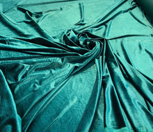 Strech velvet 60&quot; wide      Beautiful bottle green color    Fabric sold by the yard