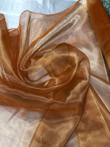 Metallic orange gold  color  100% Silk Organza 45" wide. Usable for Apparel and interior designing.