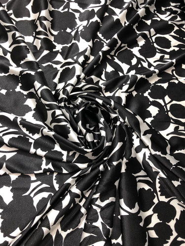Satin charmeuse print 54" wide    Beautiful black and white floral design     Fabric sold by the yard