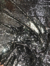 Reversible sequins fabric 54&quot; wide     Beautiful black silver color    Fabric sold by the yard