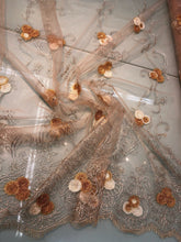 Embroidered lace on net 50&quot; wide     Beautiful champagne color embroided net fabric sold by the yard