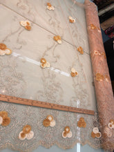 Embroidered lace on net 50&quot; wide     Beautiful champagne color embroided net fabric sold by the yard