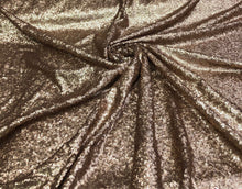 Solid sequins fabric on mesh 52&quot; wide    Top of the line quality beautiful gold color sequins on black mesh fabric sold by the yard