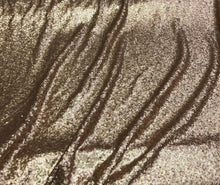 Solid sequins fabric on mesh 52&quot; wide    Top of the line quality beautiful gold color sequins on black mesh fabric sold by the yard