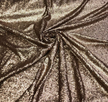 Solid sequins fabric on mesh 52&quot; wide    Top of the line quality beautiful gold color sequins on black mesh fabric sold by the yard