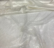 Ivory sequins on swirl mesh fabric 52&quot; wide    Fabric sold by the yard