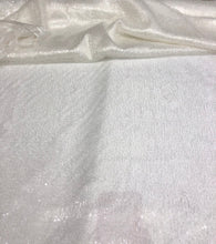 Ivory sequins on swirl mesh fabric 52&quot; wide    Fabric sold by the yard