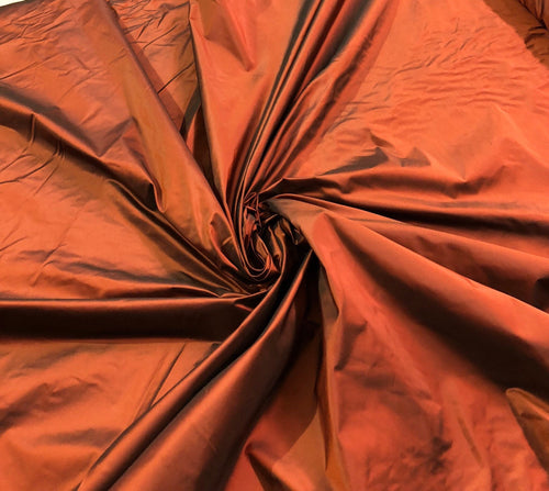 Silk taffeta 54" wide    Beautiful burnt orange color silk taffeta fabric sold by the yard