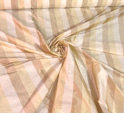 100% silk shantung stripe, 54" wide. Beautiful ivory brownish yellow gold. Fabric sold by the yard.
