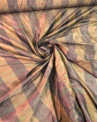 Raw silk shantung stripe 54" wide   Beautiful brwon purple color     Fabric sold by the yard