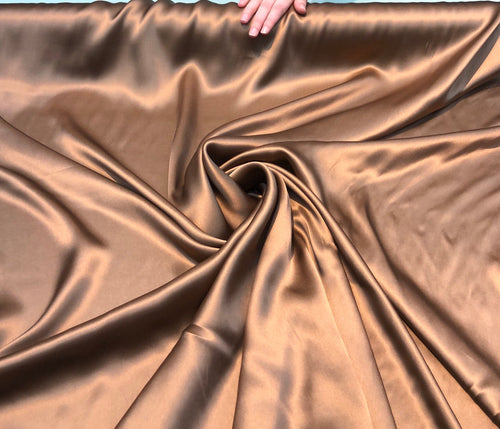 Silk charmouse 54" wide   Beautiful copper color silk charmouse fabric sold by the yard