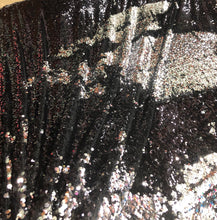 Reversible sequins fabric 54&quot; wide     Beautiful black silver color    Fabric sold by the yard