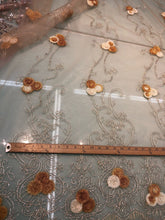 Embroidered lace on net 50&quot; wide     Beautiful champagne color embroided net fabric sold by the yard