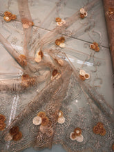 Embroidered lace on net 50&quot; wide     Beautiful champagne color embroided net fabric sold by the yard