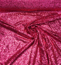 Solid sequins on mesh 52&quot; wide    Top of the line sequins beautiful fusia color sequin fabric sold by the yard