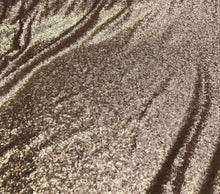 Solid sequins fabric on mesh 52&quot; wide    Top of the line quality beautiful gold color sequins on black mesh fabric sold by the yard