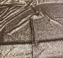 Solid sequins fabric on mesh 52&quot; wide    Top of the line quality beautiful gold color sequins on black mesh fabric sold by the yard