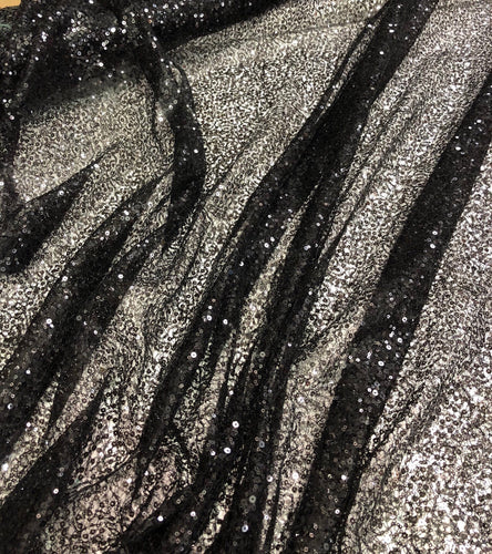 Black sequins on swirl meah fabric 52" wide   Fabric sold by the yard