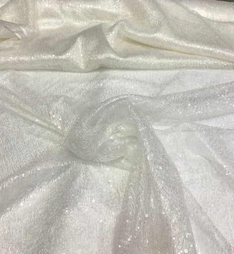 Ivory sequins on swirl mesh fabric 52" wide    Fabric sold by the yard