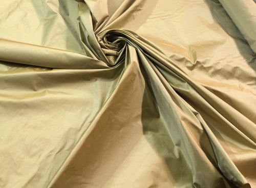 Gold silk taffeta 54" wide   Beautiful iridescent gold color silk taffeta fabric sold by the yard