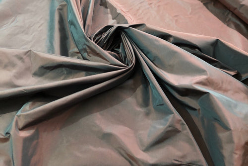 Silk taffeta 54" wide    Beautiful dark steel gray with burnt orange iridescent color silk taffera fabric sold by the yard
