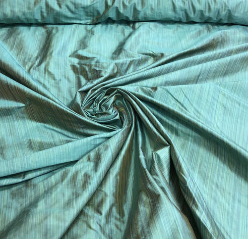 Silk shantung 54" wide   Beautiful pinstripe turquise color silk shantung fabric sold by the yard