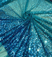 Sequin on tule 58&quot; wide   Beautiful turquise color border style sequin fabric sold by the yard