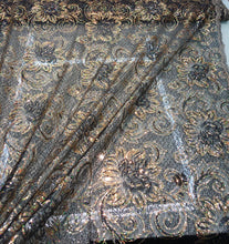 Allover floral pattern sequins 56&quot; wide   Beautiful black & gold floral pattern sequins fabric sold by the yard