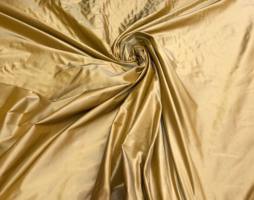Silk taffeta 54" wide     Beautiful iridescent antique gold color ailk taffeta fabric sold by the yard