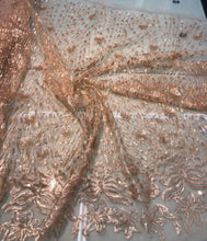 Floral abstract design sequins embroidered on mesh fabric sold by the yard