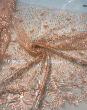 Floral abstract design sequins embroidered on mesh fabric sold by the yard