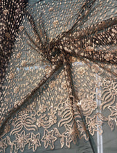 Floral abstract design sequins embroidered on mesh fabric sold by the yard