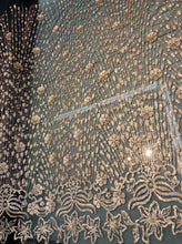 Floral abstract design sequins embroidered on mesh fabric sold by the yard