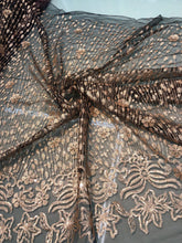 Floral abstract design sequins embroidered on mesh fabric sold by the yard