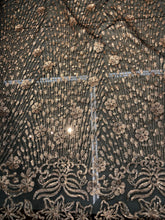 Floral abstract design sequins embroidered on mesh fabric sold by the yard