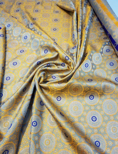 Jaquard floral brocade 44" wide   Beautiful yellow orange brocade fabric sold by the yard   Useable for apparel and interior decore