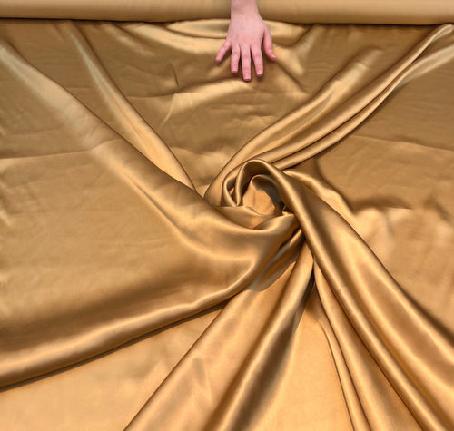 Silk charmouse 44" wide   Beautiful gold color silk charmouse fabric sold by the yard
