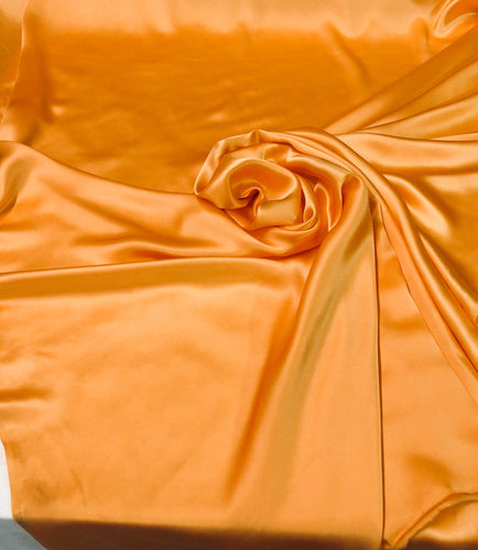 Silk charmouse 54" wide    Beautiful soft  orange color silk satin charmeuse fabric sold by the yard