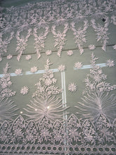 White bridal lace 52â wide.  Beautiful white bridal lace, border style white bridal lace fabric sold by the yard.