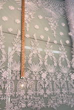 White bridal lace 52â wide.  Beautiful white bridal lace, border style white bridal lace fabric sold by the yard.