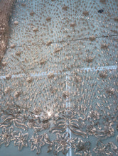 Floral abstract design sequins embroidered on mesh fabric sold by the yard