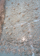 Floral abstract design sequins embroidered on mesh fabric sold by the yard