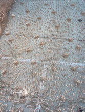 Floral abstract design sequins embroidered on mesh fabric sold by the yard