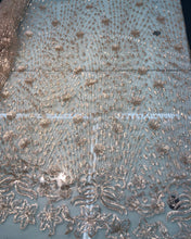 Floral abstract design sequins embroidered on mesh fabric sold by the yard