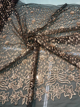 Floral abstract design sequins embroidered on mesh fabric sold by the yard