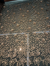 Floral abstract design sequins embroidered on mesh fabric sold by the yard