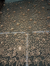 Floral abstract design sequins embroidered on mesh fabric sold by the yard